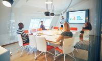 manager-and-staff-discussing-charts-together-in-an-office-boardroom.jpg
