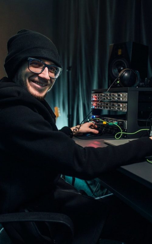 a-sound-engineer-uses-a-mixing-board-and-software-to-create-audio-track-.jpg