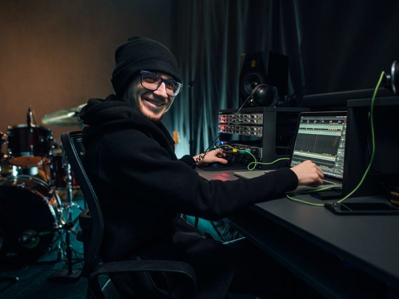 a-sound-engineer-uses-a-mixing-board-and-software-to-create-audio-track-.jpg