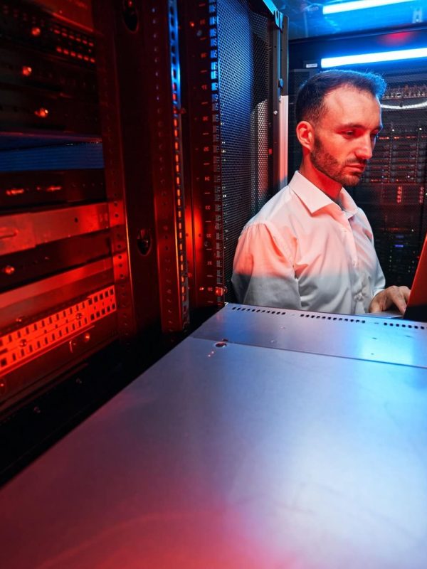 data-center-administrator-inspecting-server-rack-software-1.jpg