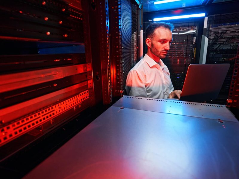 data-center-administrator-inspecting-server-rack-software-1.jpg