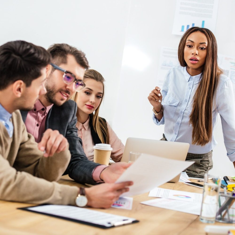 multicultural-group-of-marketing-managers-working-on-project-together-in-office.jpg