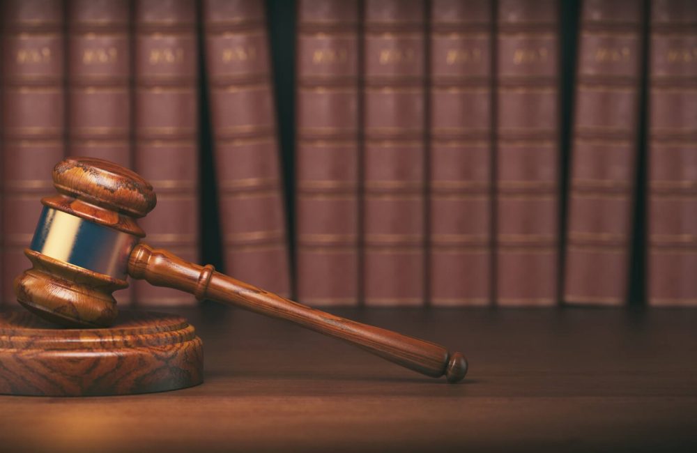 gavel-on-the-background-of-vintage-lawyer-books-concept-of-law-1.jpg