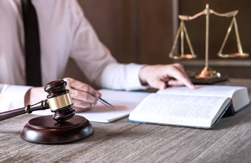 male-lawyer-or-judge-working-with-law-books-1.jpg